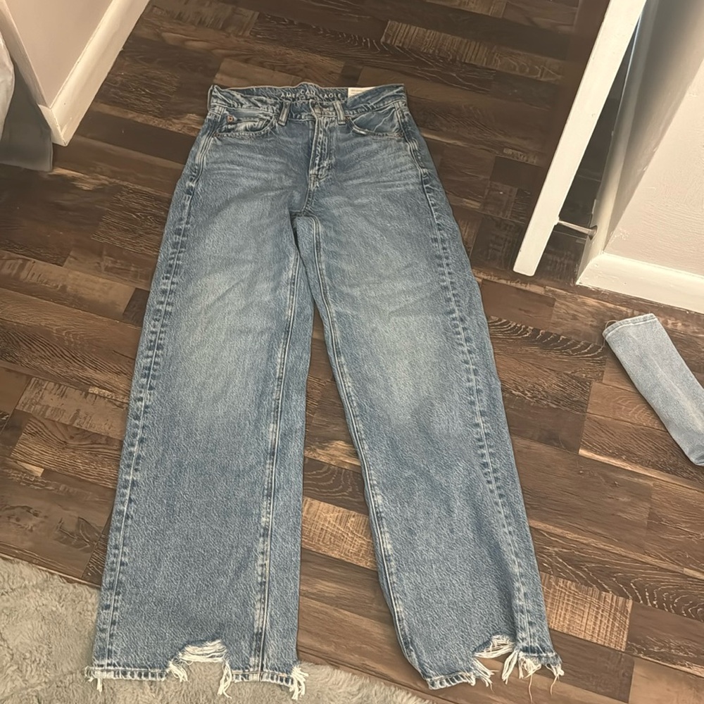 New with tags.  American Eagle Dreamy Drape super high rise Jeans.  Size O
